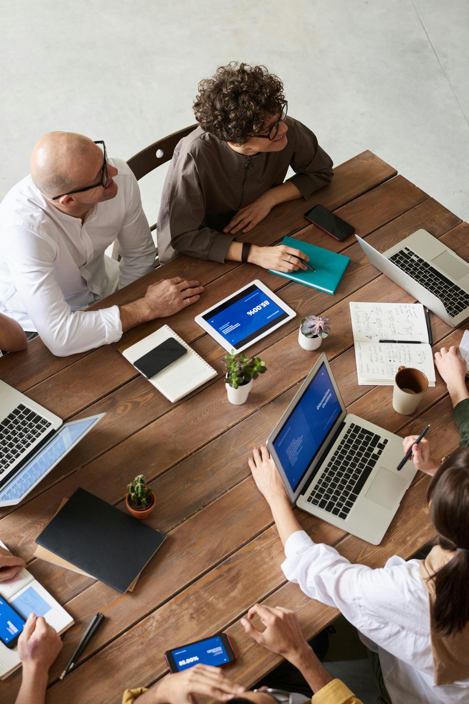 Team meeting around a wooden table