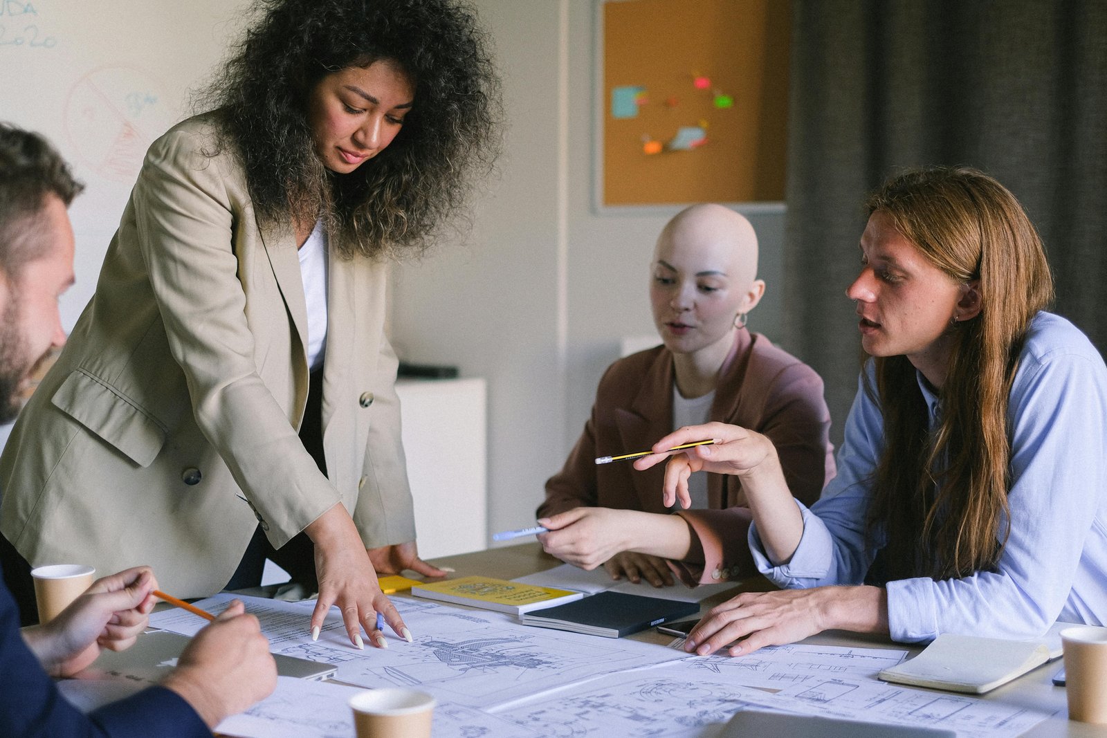 Designer leading a planning session with colleagues